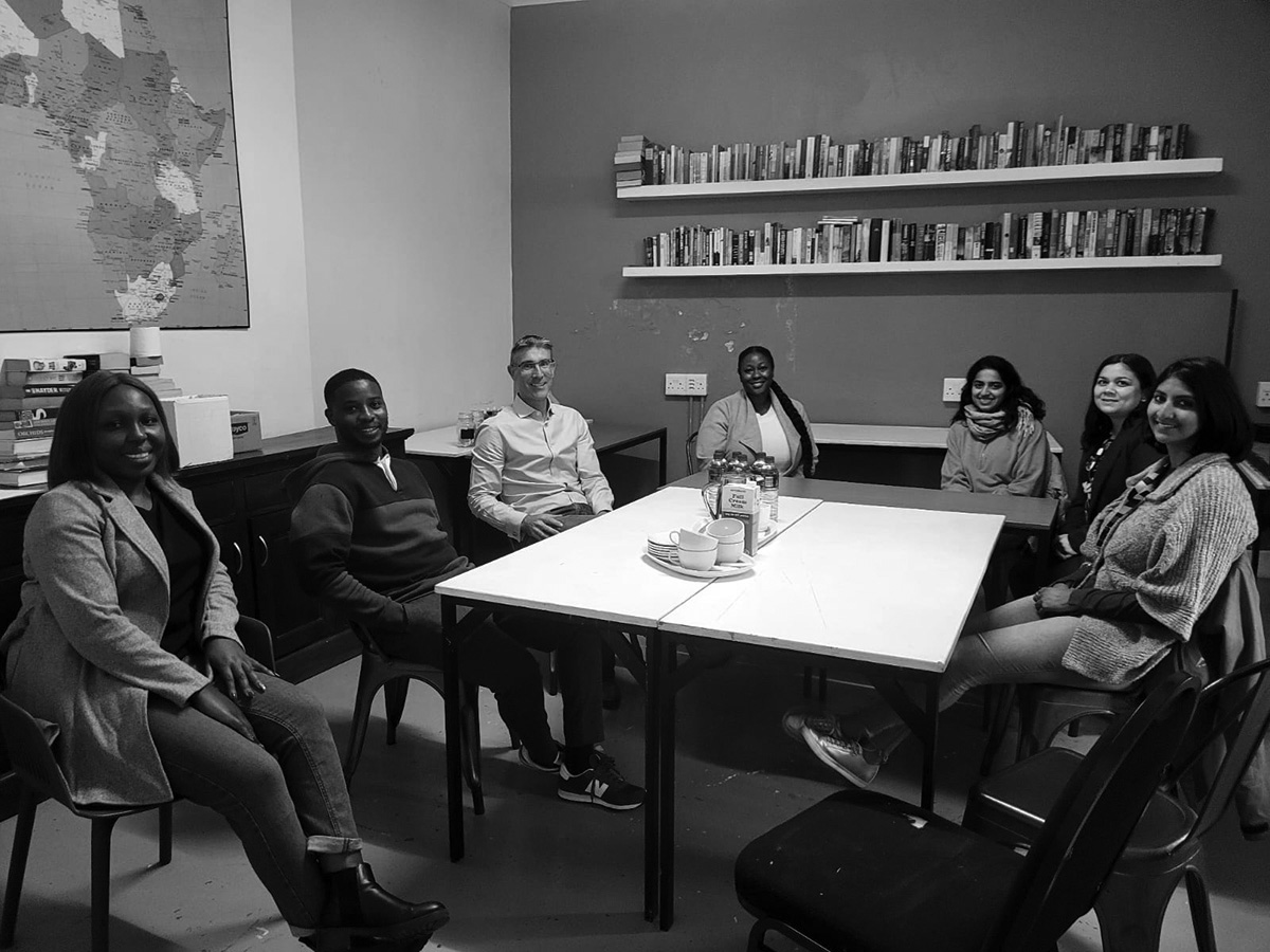 CEO of Construct Lorcan Mc Hugh and the Cape Town team sit with The Homestead staff.