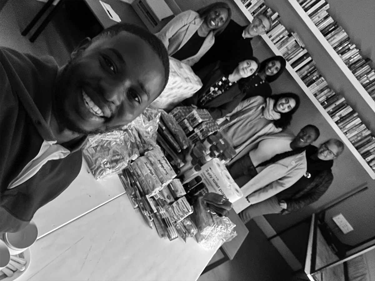 Homestead Board Member, Arafat Gatabazi, takes a selfie with the Construct and Homestead teams