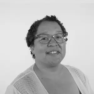 Black and white head and shoulders photograph of Liesel Slingers.